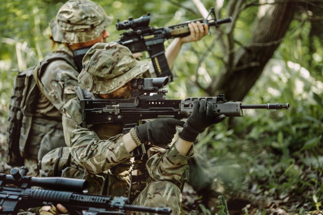 British special forces soldiers with weapon take part in military maneuver. war, army, technology and people concept.; Shutterstock ID 460673218; purchase_order: -; job: -; client: -; other: -