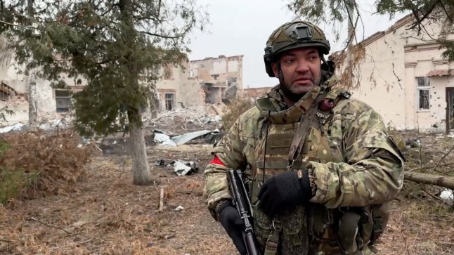 A Russian army soldier walks along a ruined street of Malaya Loknya settlement, which was recently retaken by Russia's armed forces in the course of Russia-Ukraine conflict in the Kursk region, Russia, in this still image taken from video released March 13, 2025. Russian Defence Ministry/Handout via REUTERS ATTENTION EDITORS - THIS IMAGE HAS BEEN SUPPLIED BY A THIRD PARTY. NO RESALES. NO ARCHIVES. MANDATORY CREDIT.