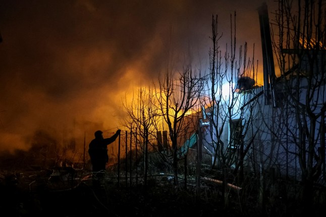 Rescuers work at the site of a building destroyed during a Russian air strike, amid Russia's attack on Ukraine, in Kherson, Ukraine March 14, 2025. REUTERS/Ivan Antypenko